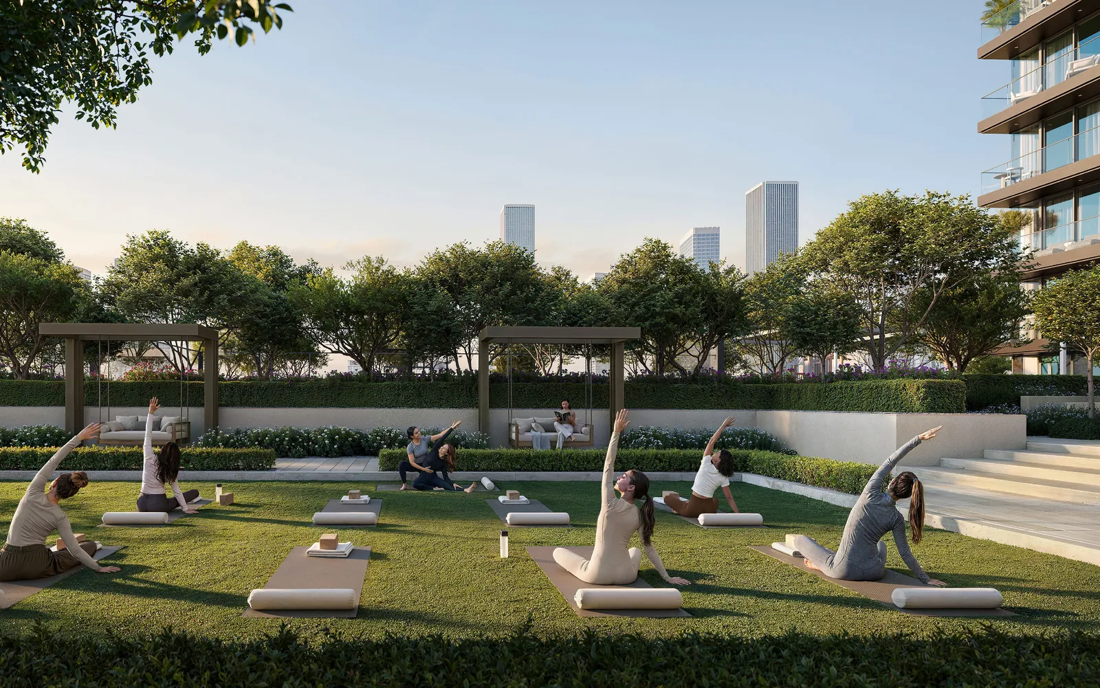 Residents practicing yoga on Valia by Emaar's outdoor yoga deck overlooking linear park